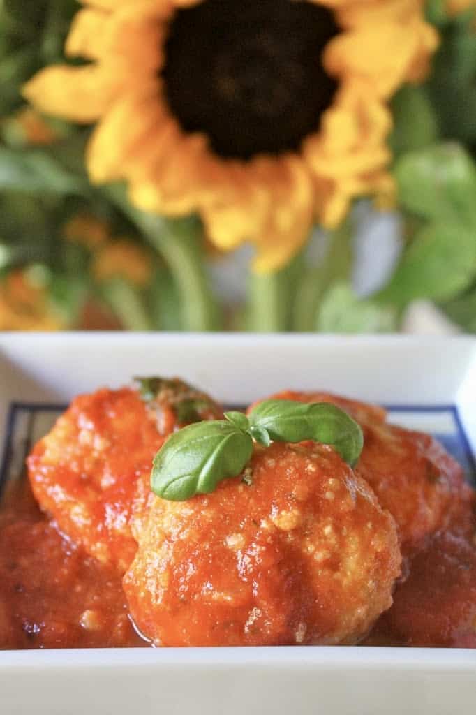 ricotta gnudi with a sunflower in the background