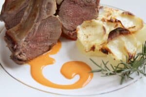 swirl on a plate with lamb and potatoes