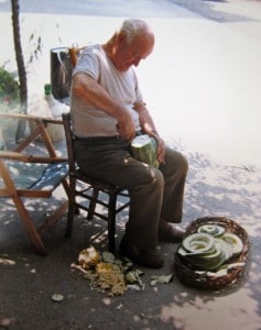 Nonno coring a big zucchini to dry