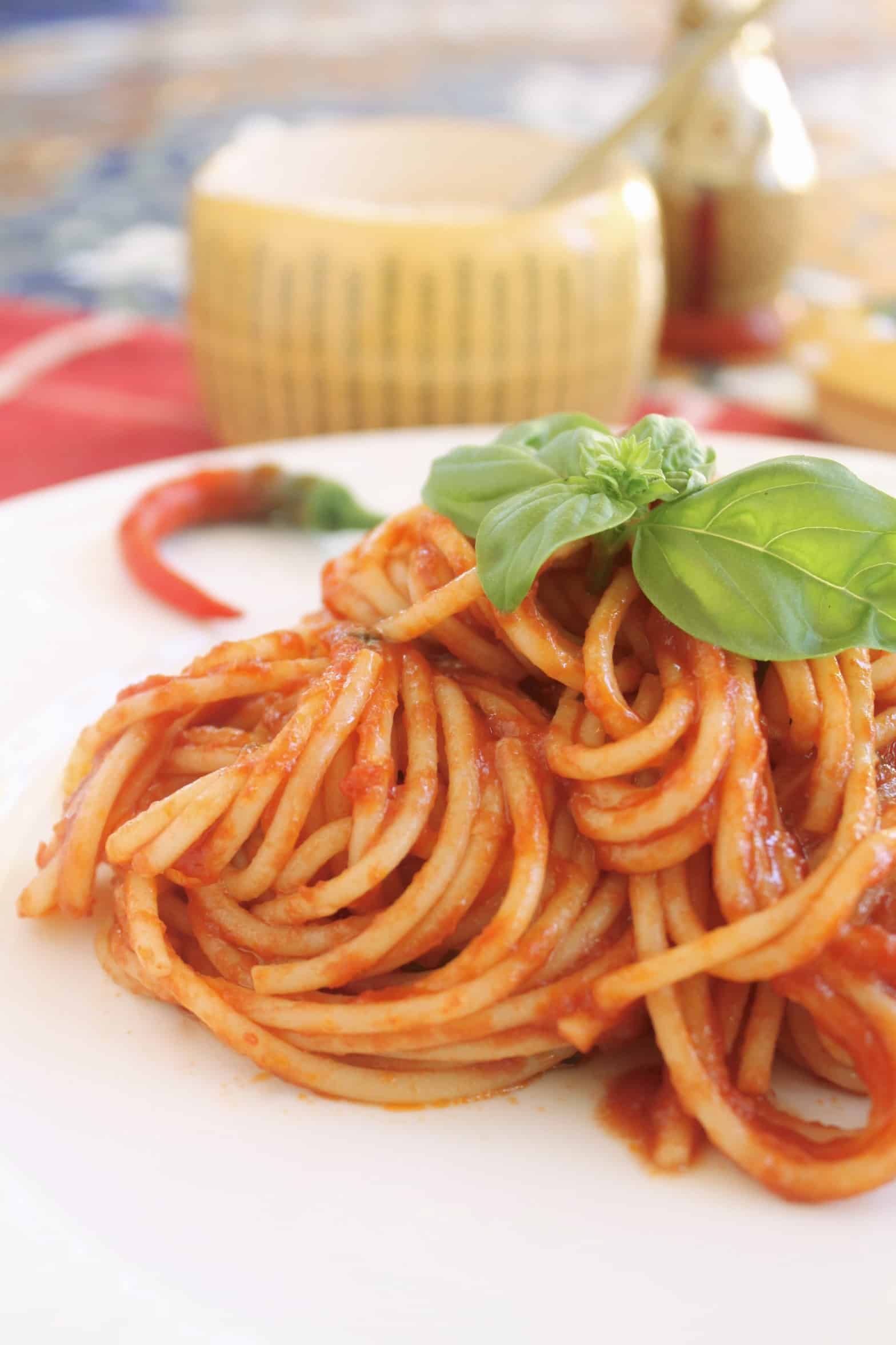 plate of spaghetti with basil