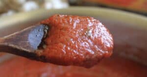 tomato sauce on a wooden spoon
