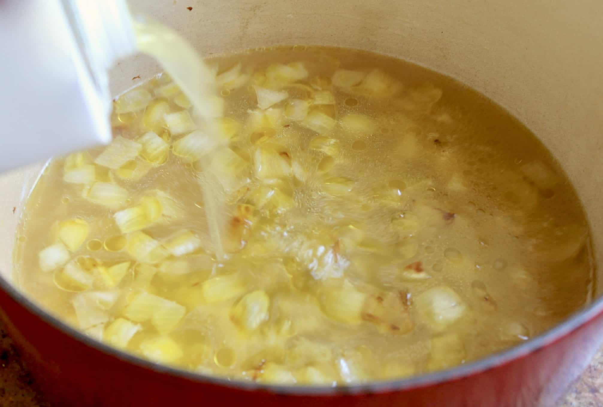 adding stock to soup