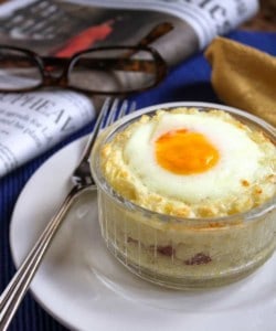 baked breakfast cups with bacon in a ramekin with newspaper