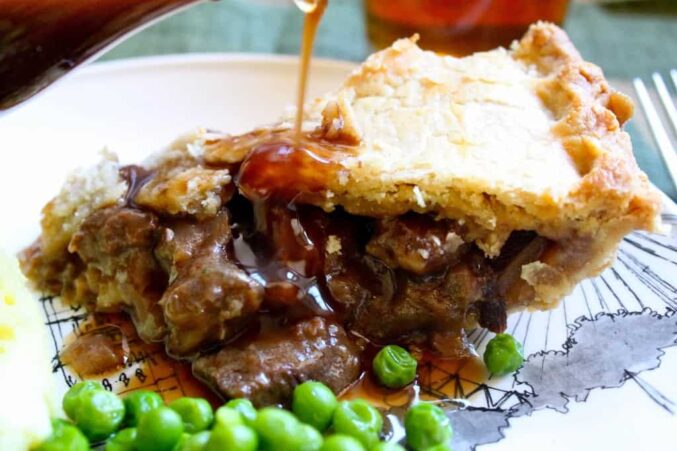 Steak pie with peas and gravy