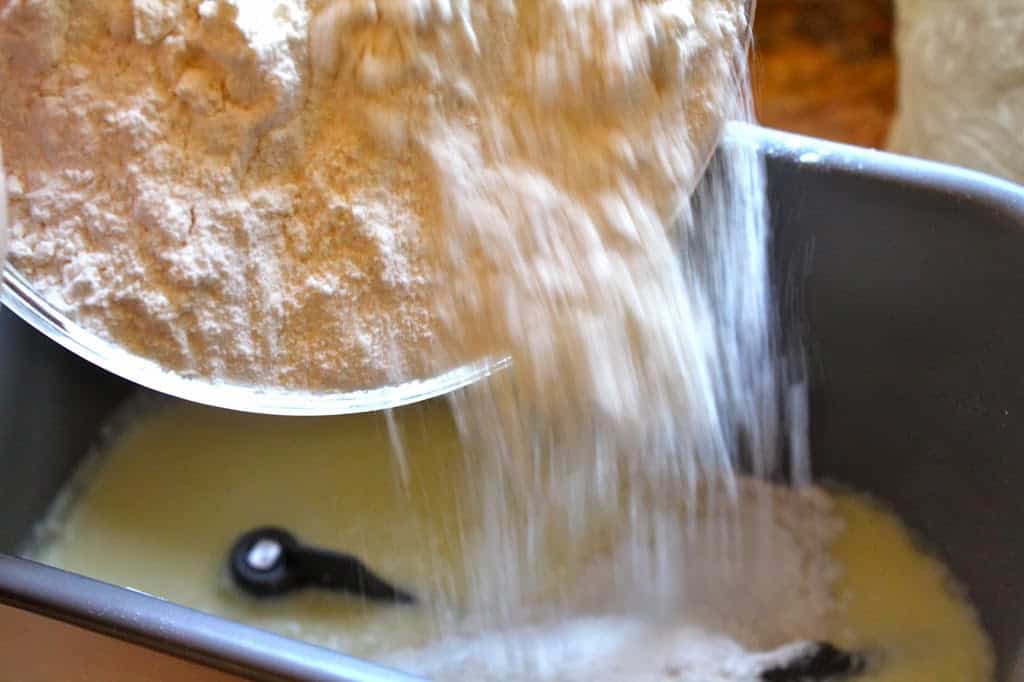 adding flour to bread machine