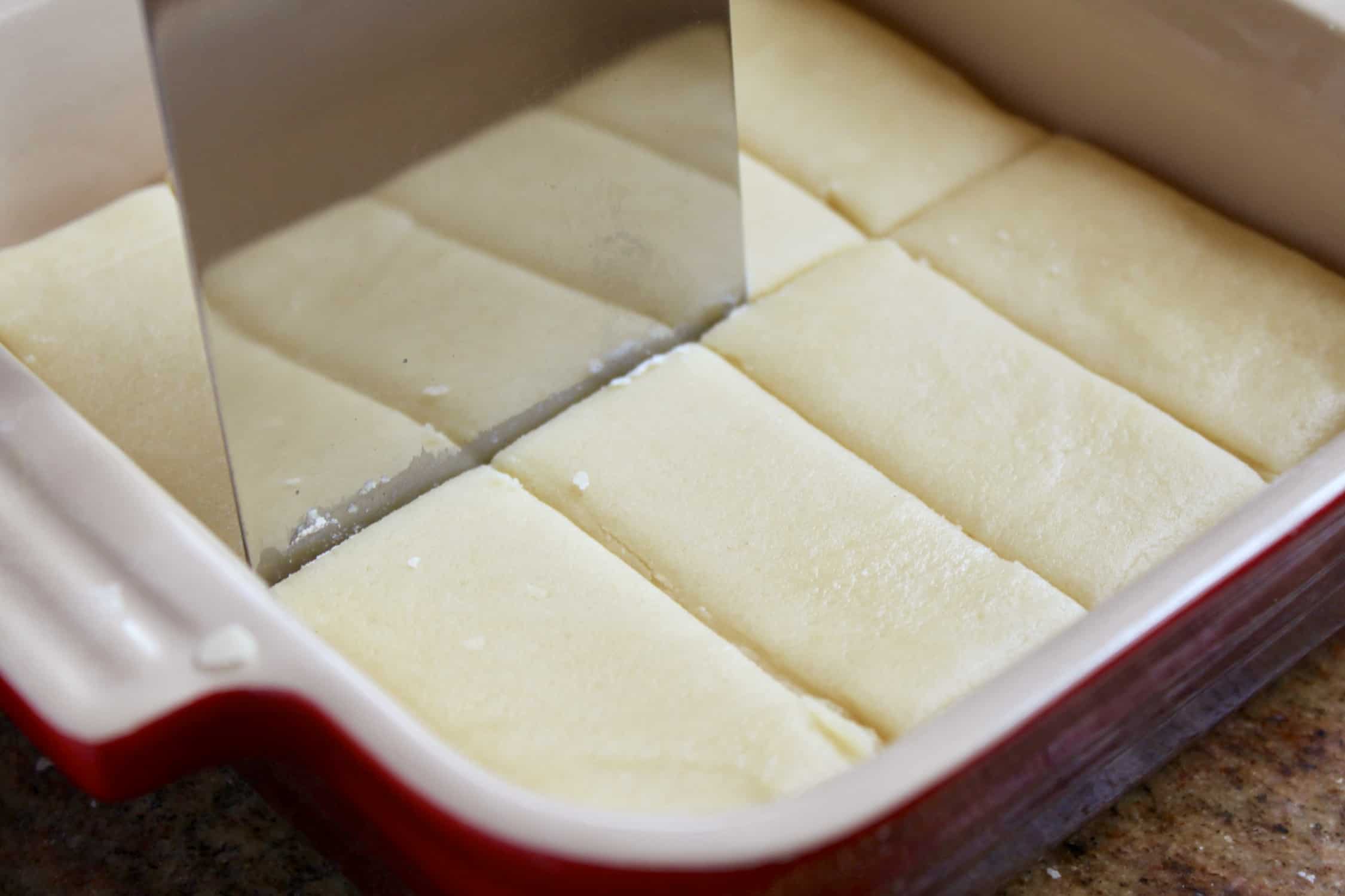 shortbread cookie recipe dough being cut into fingers