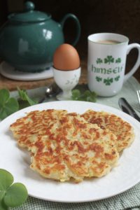 Irish boxty with cup of tea and soft boiled egg