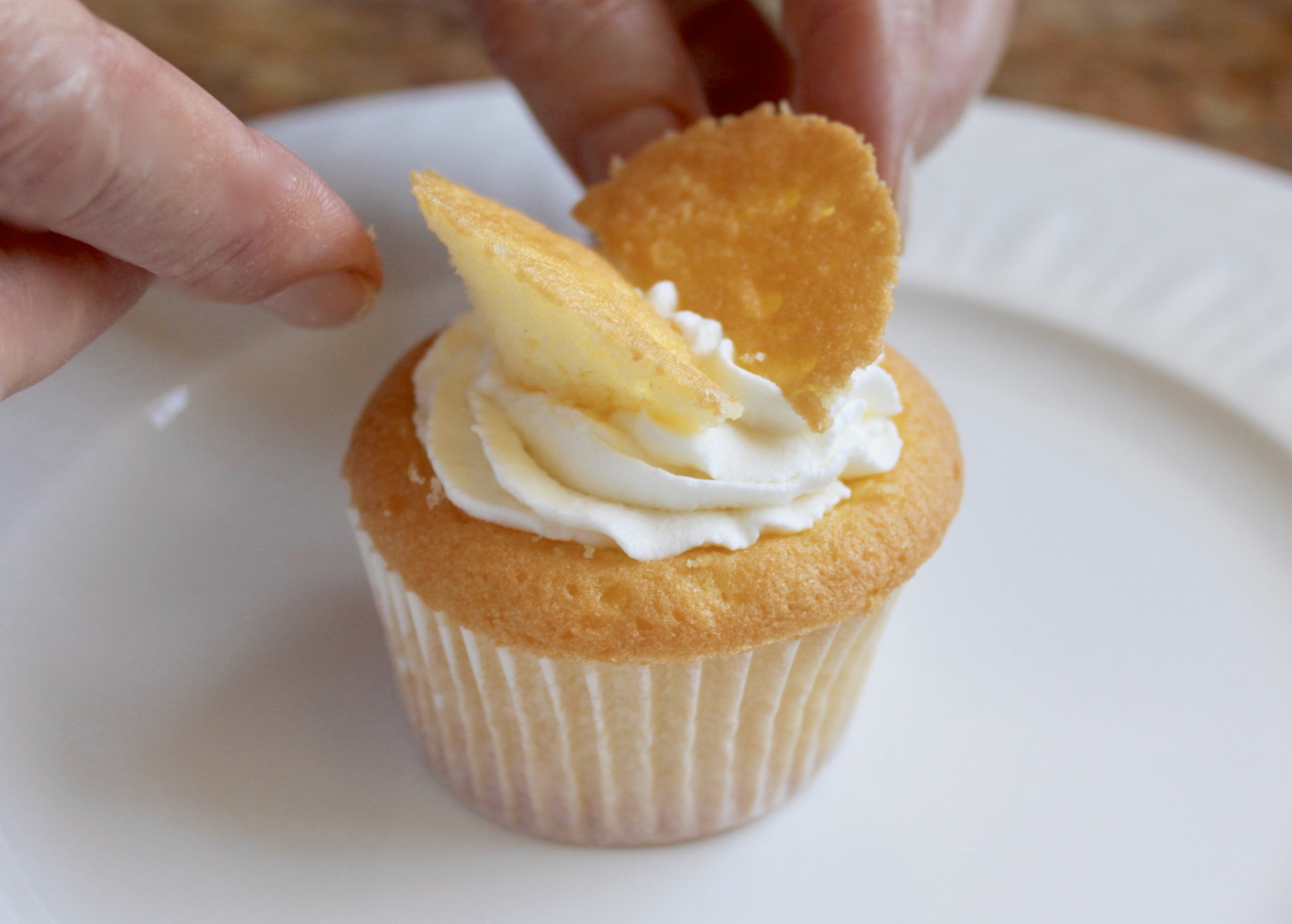 adding the wings to the butterfly cupcake