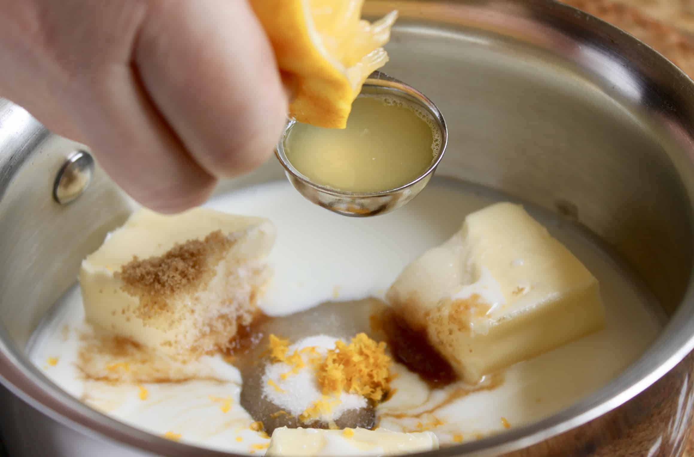 squeezing lemon juice into the pot with other ingredients