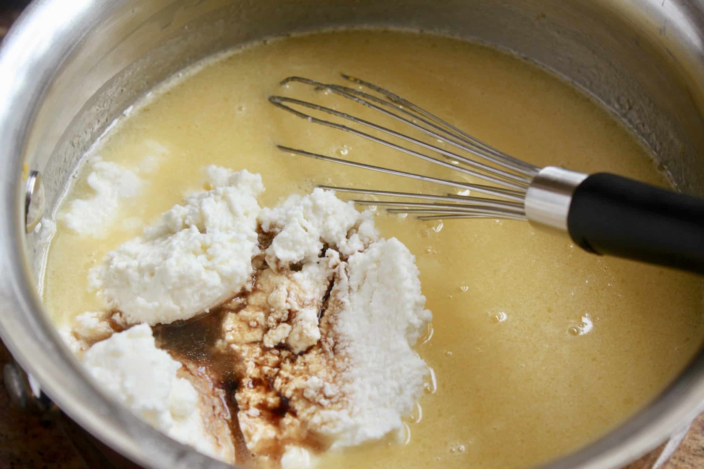 adding vanilla and ricotta to the pancake mixture