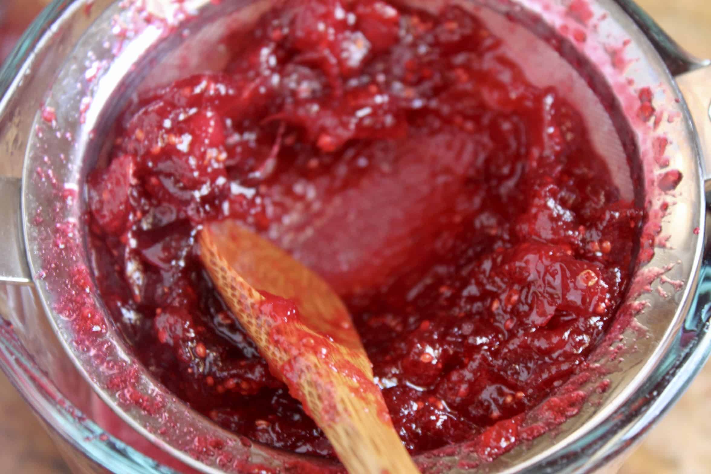 putting cranberries through a sieve