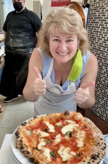 Christina with pizza in Naples