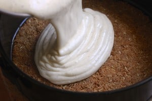 pouring batter for New York style cheesecake recipe