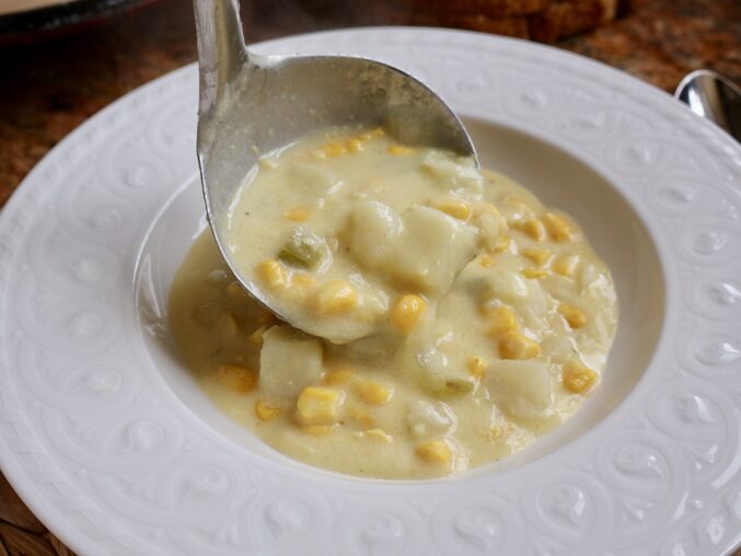 ladling creamy corn chowder