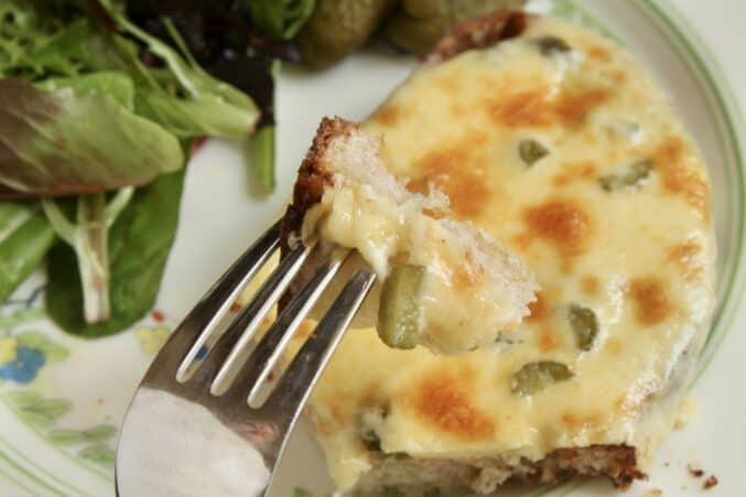 Bite of Irish rarebit on a fork