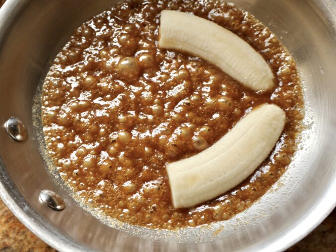 Adding bananas to pan