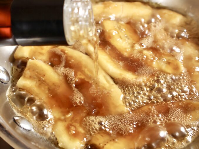 adding rum to pan