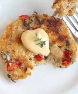 half eaten crab cake on a plate