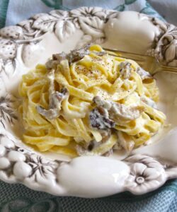 mushroom pasta with a creamy ricotta sauce in a pretty bowl