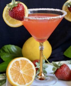 strawberry lemon drop martini with lemons and strawberries