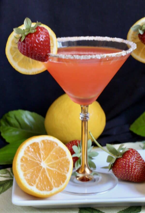 strawberry lemon drop martini with lemons and strawberries