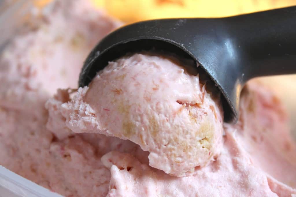 Scooping rhubarb crumble ice cream