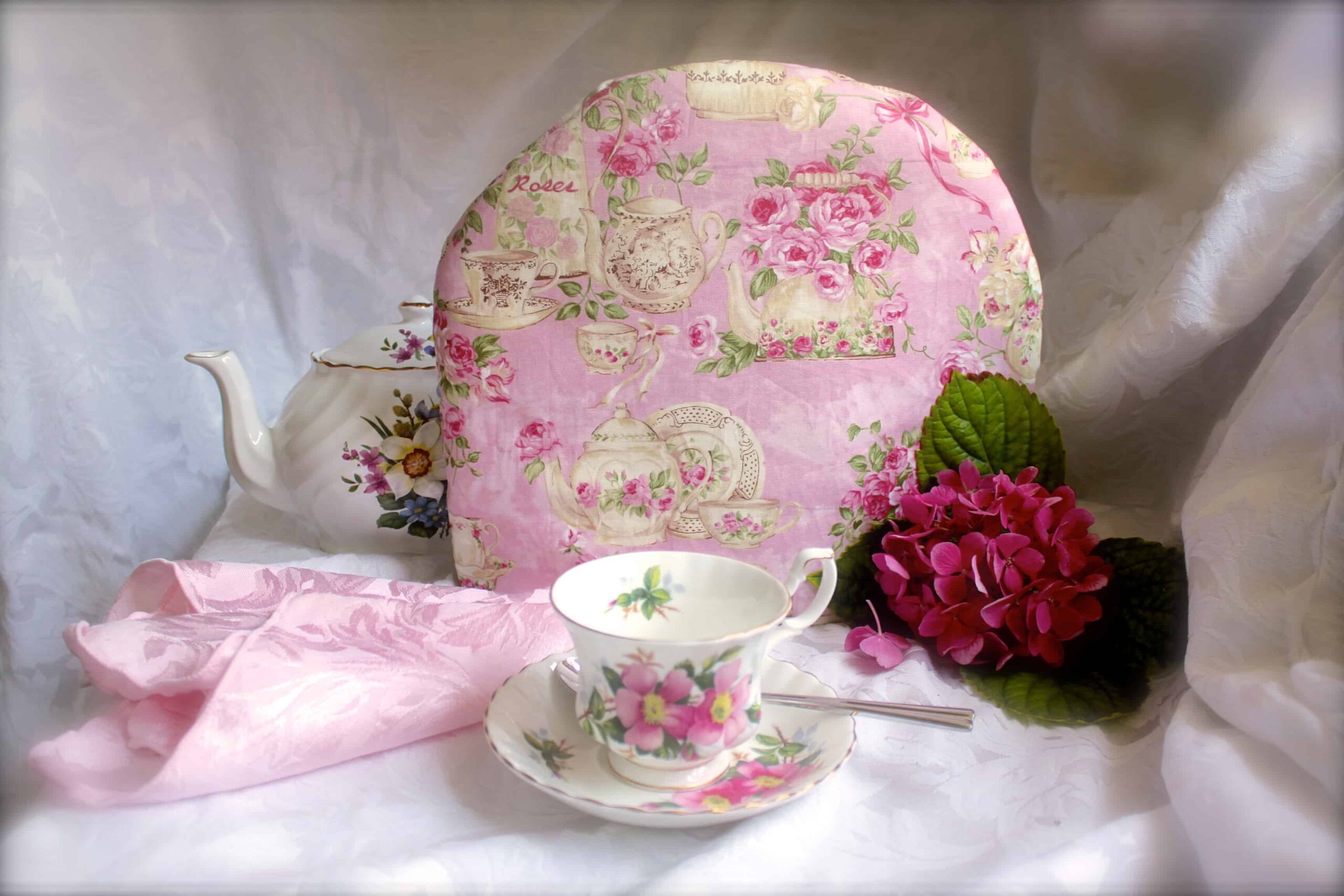 tea cosy and cup and saucer