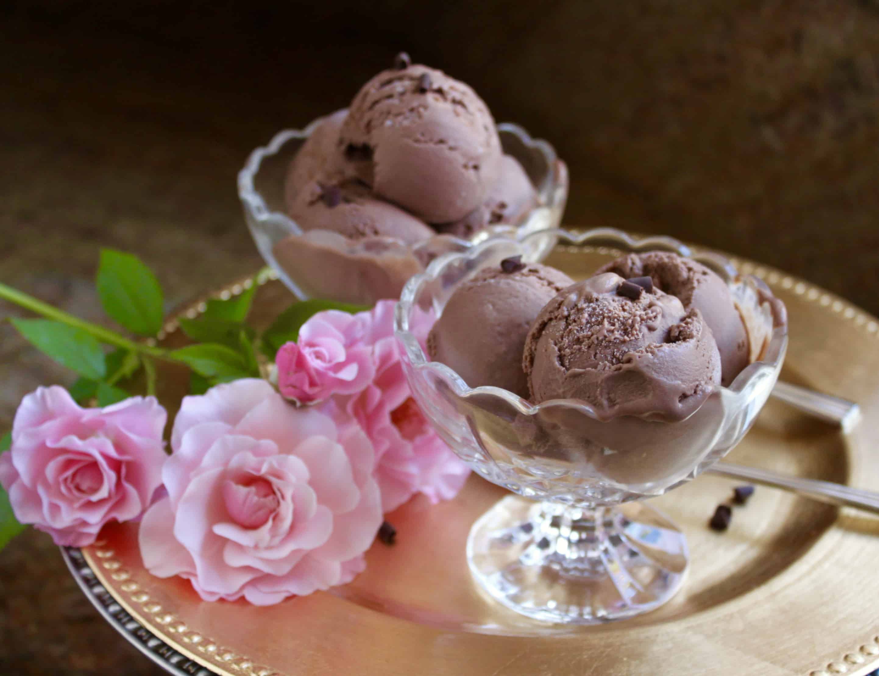 Best ever chocolate custard ice cream in bowls with pink roses