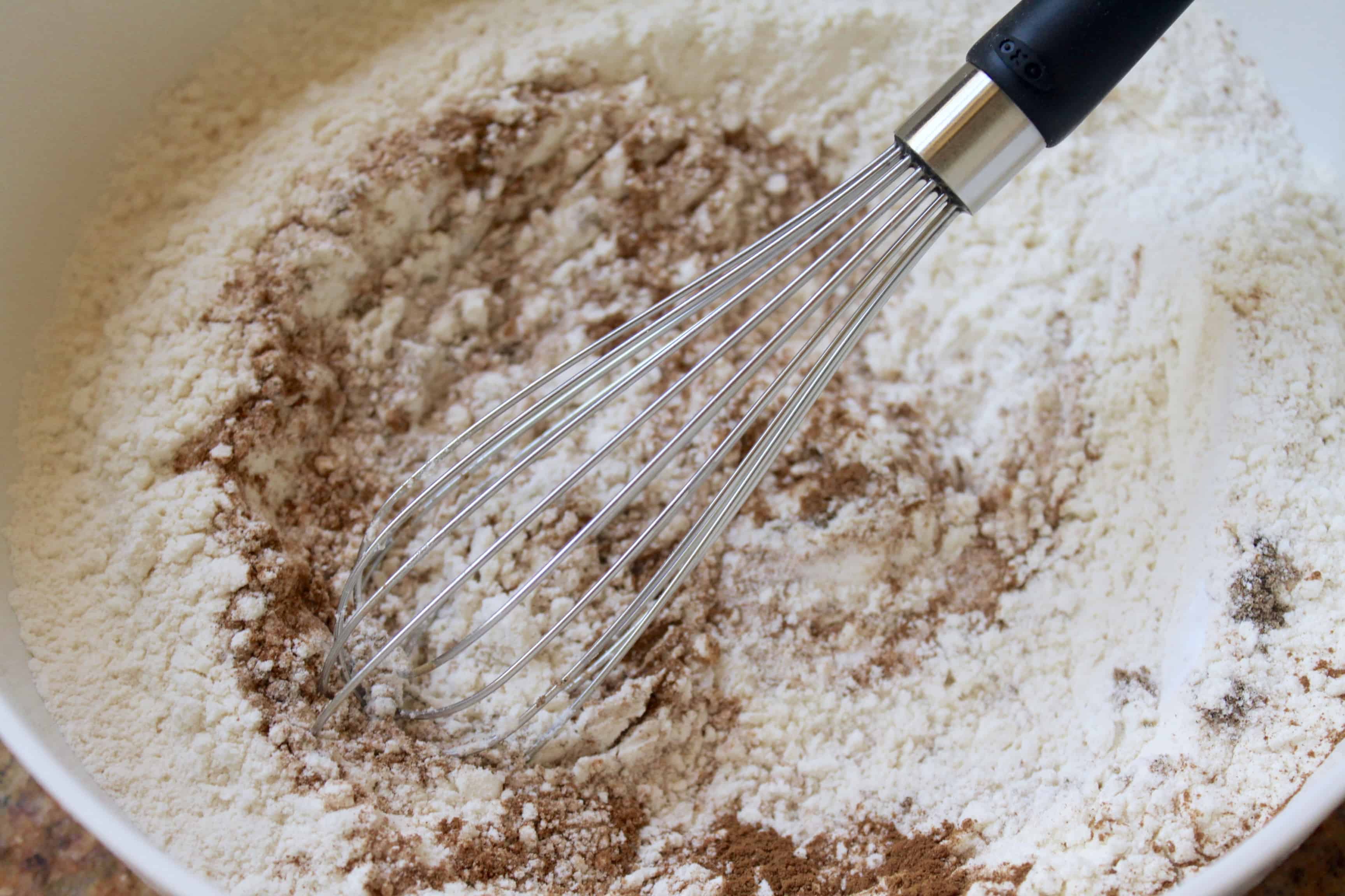 Whisking dry ingredients together with an OXO whisk