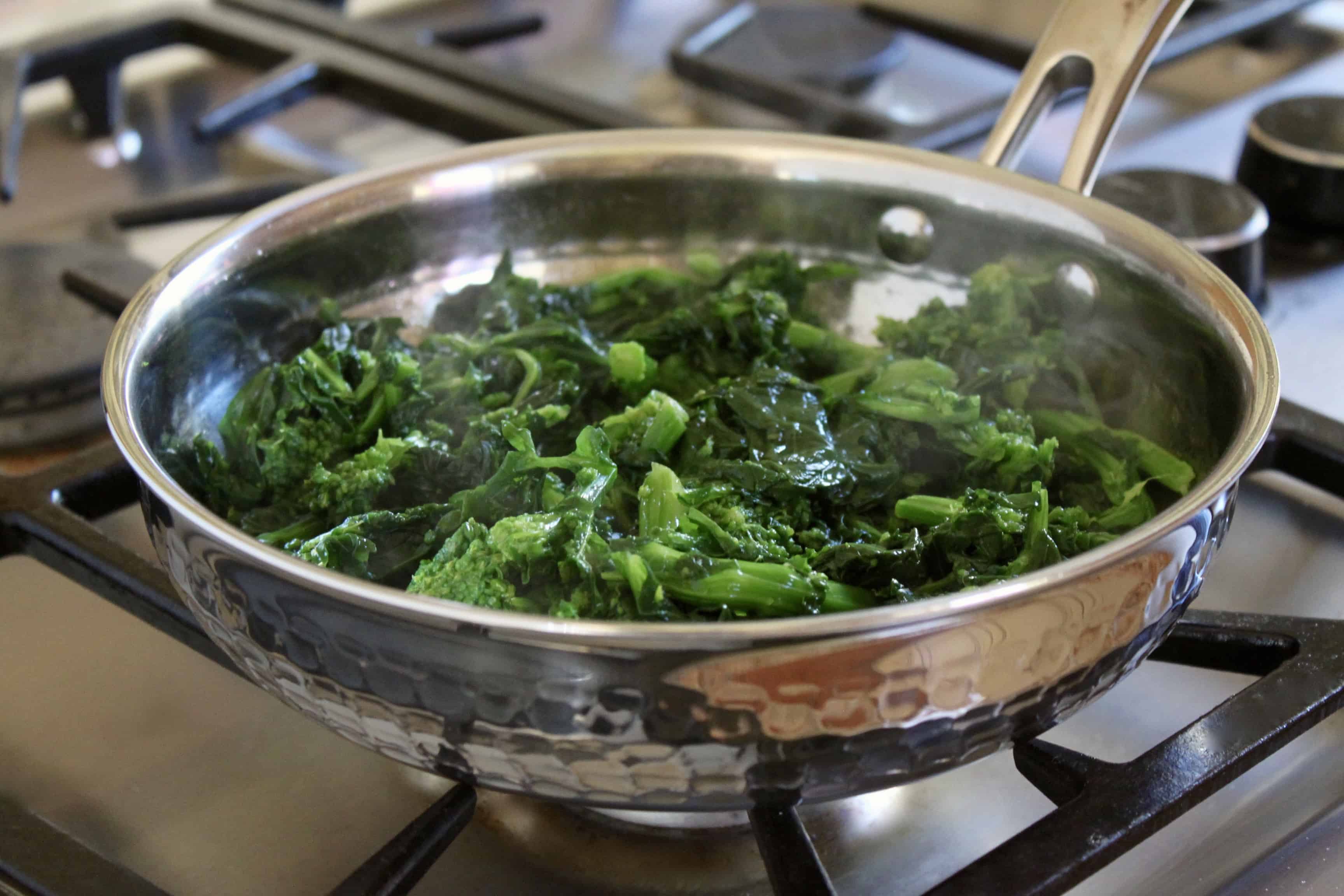 pan on the cooktop with rapini