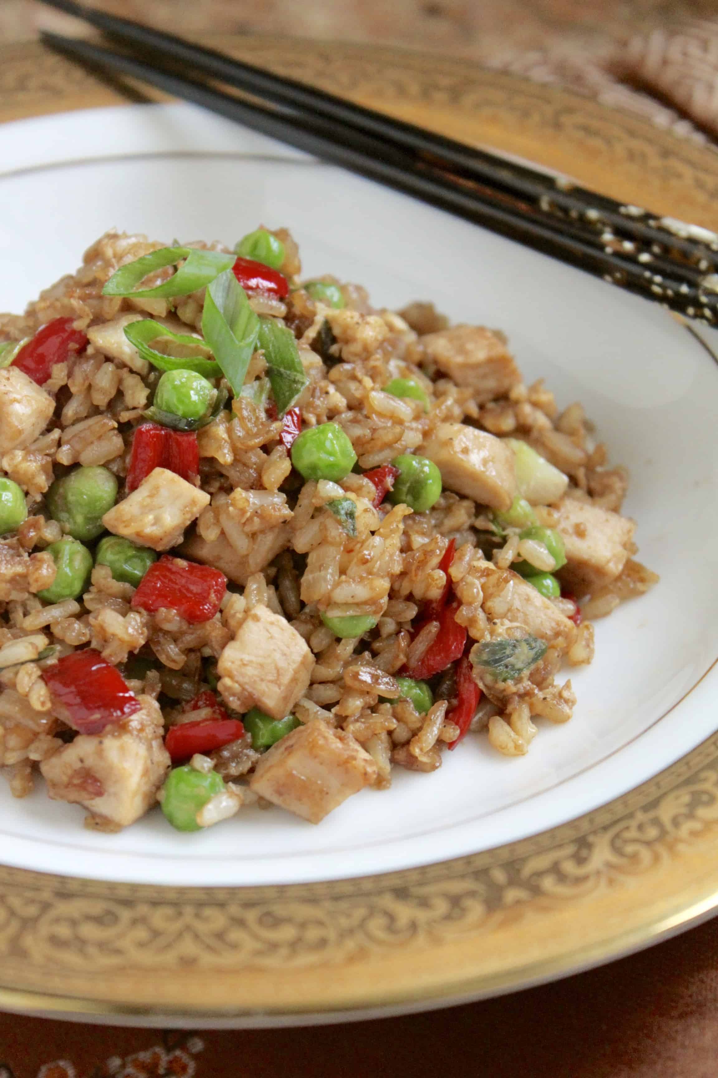 Fleming's Turkey Fried Rice on a white and gold plate with chopsticks