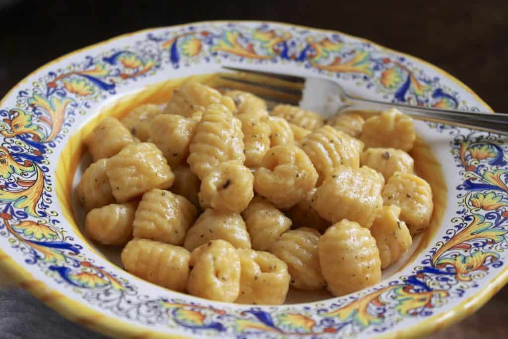 Potato pumpkin gnocchi in a bowl.