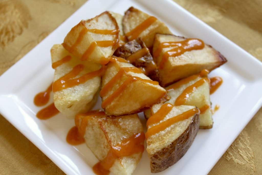 Patatas Bravas on a square plate