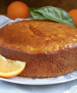 Sicilian Whole Orange cake on a plate with oranges