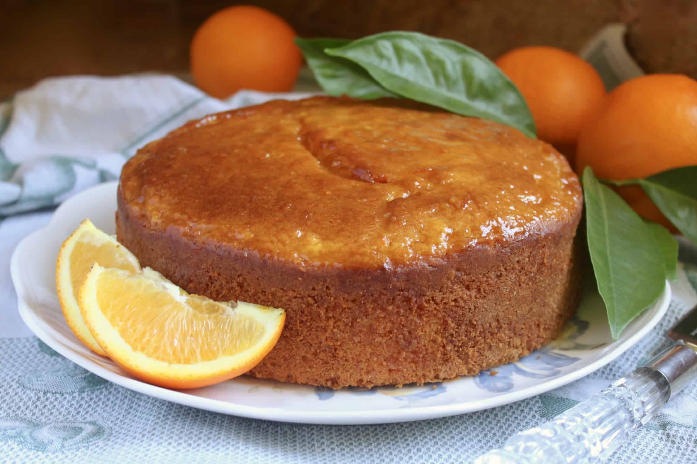 Sicilian Whole Orange cake on a plate with oranges