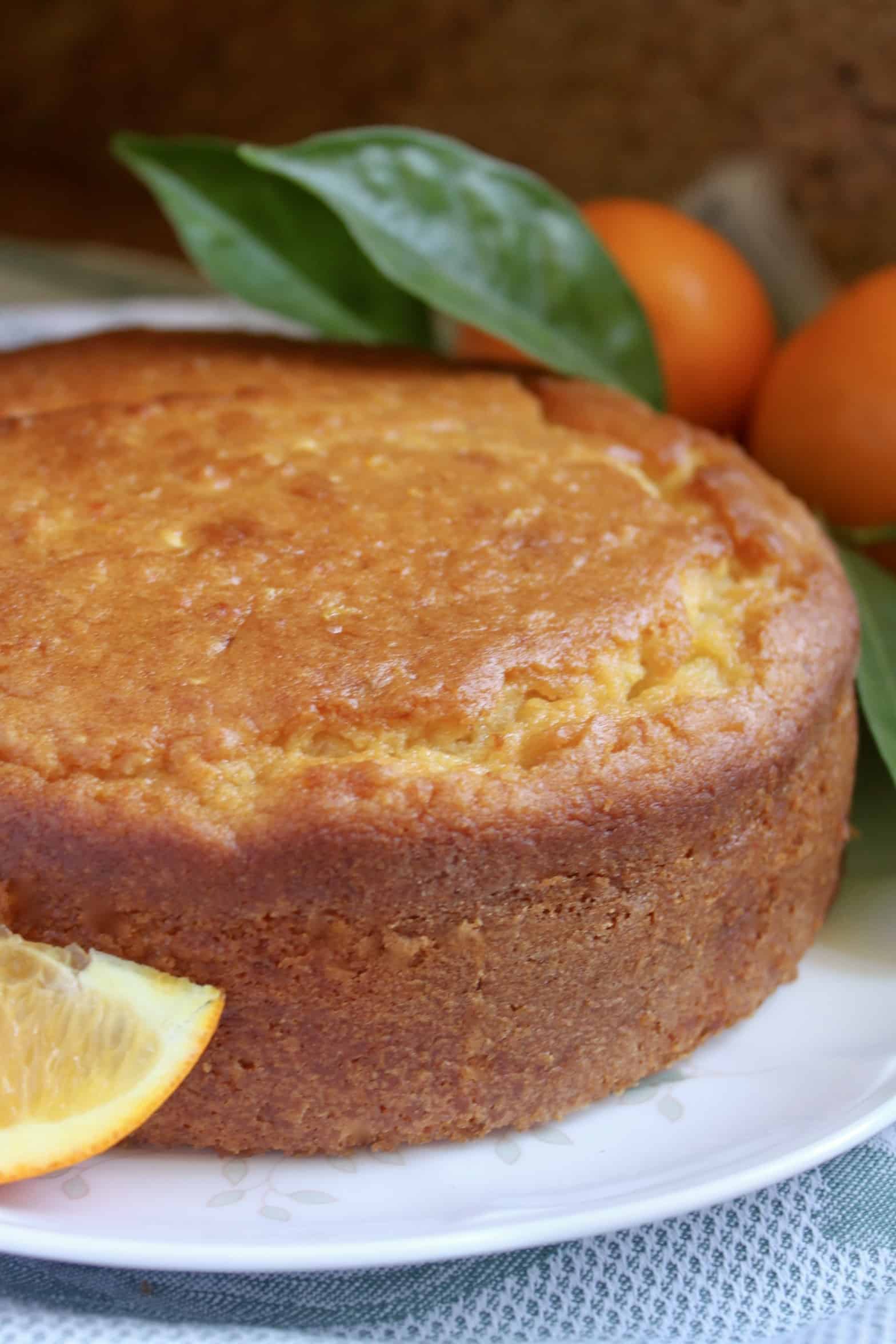 Sicilian Whole Orange cake on a plate with oranges