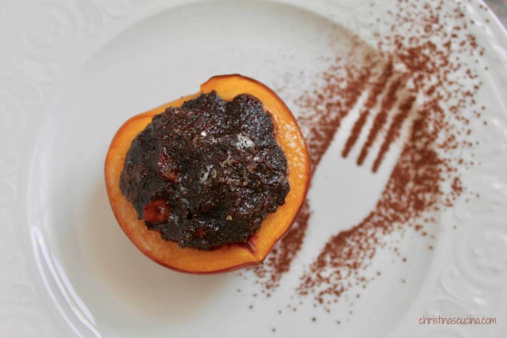 Italian style baked peach filled with cocoa and biscuits