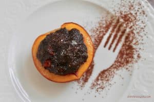 Italian style baked peaches filled with cocoa and biscuits