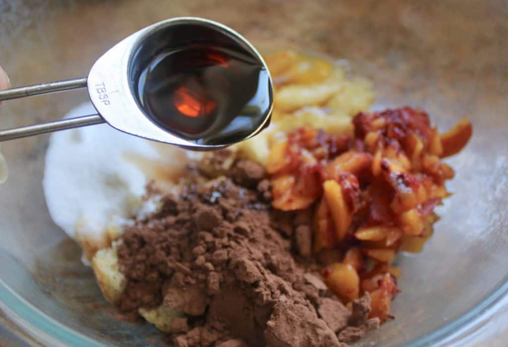 Italian style baked peaches filled with cocoa and biscuits