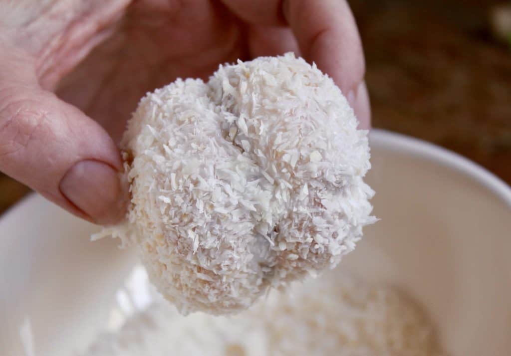 dipping a snowball in coconut