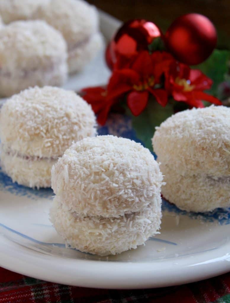 Scottish Snowball cookies on a plate with baubles behind