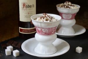 Authentic Rudesheimer coffees in the proper cups and saucers with brandy 