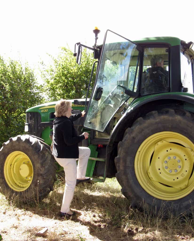 Mum getting into a tractor in France