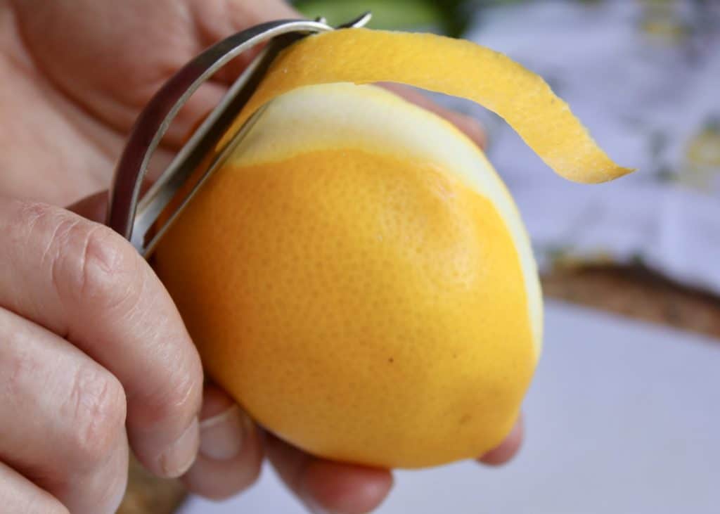 peeling Meyer lemon for crema di limoncello
