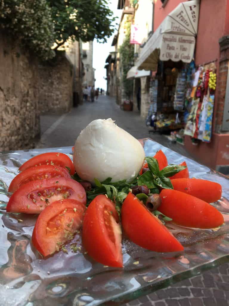 caprese salad on a glass plate