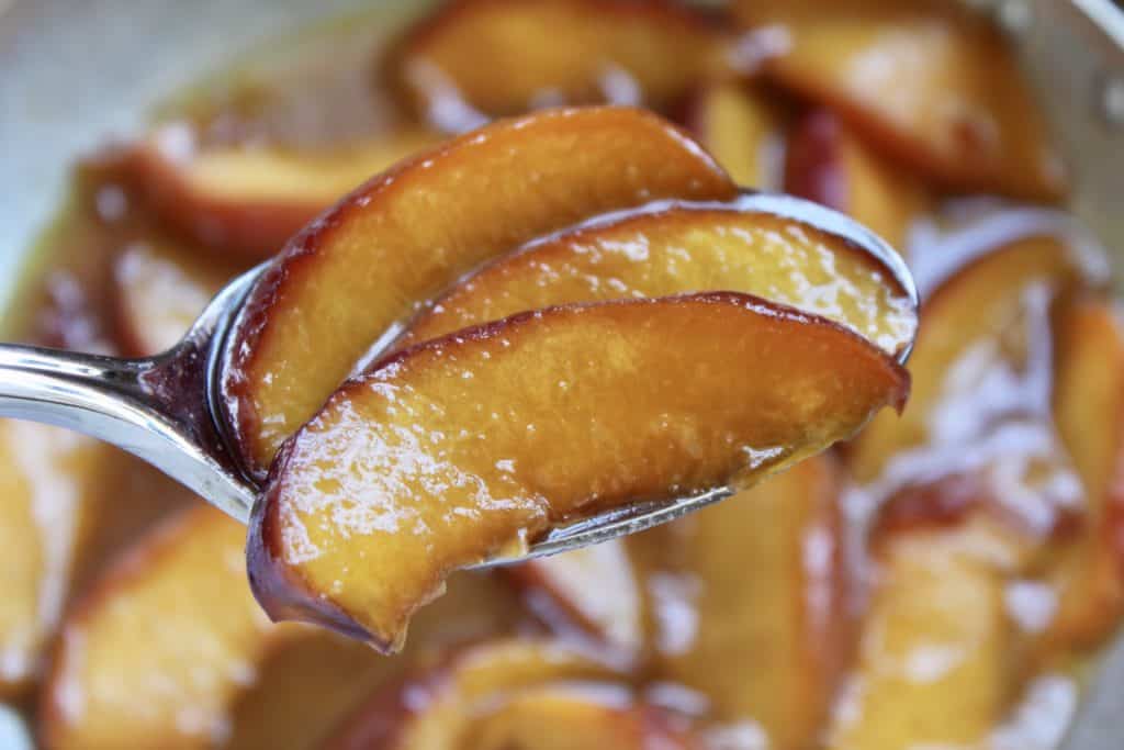 buttery maple peach topping on overnight waffles