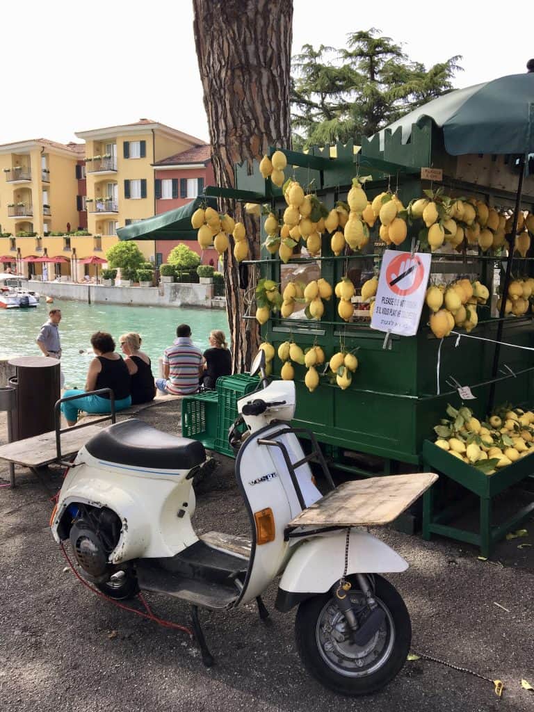 Vespa and a lemonade stand in Sirmione, Lake Garda (visiting Sirmione by car)