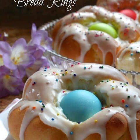 individual Italian Easter bread rings with pastel eggs