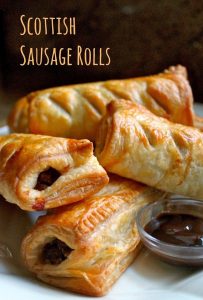 scottish sausage rolls on a plate with HP Sauce