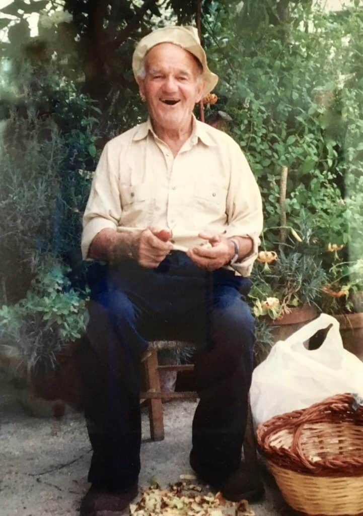 Nonno Scipione laughing while peeling apples